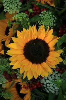 Big yellow sunflowers in a wedding flower arrangement