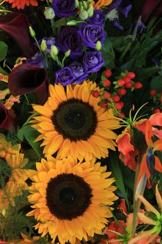 Big yellow sunflowers in a wedding flower arrangement