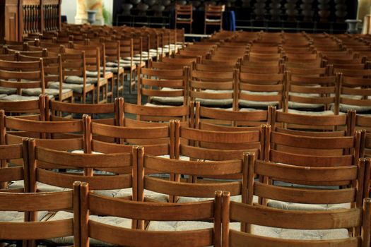 Simple wooden chairs in a Dutch Reformed Church