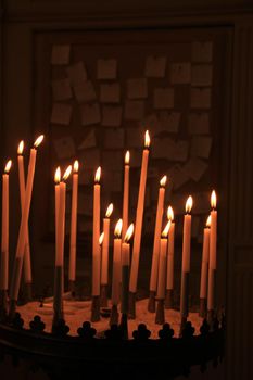 Long thin candles in a roman catholic church