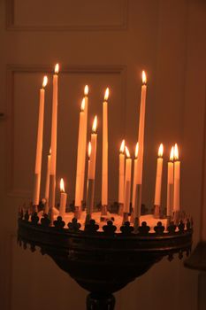 Long thin candles in a roman catholic church