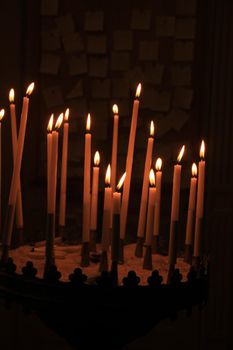 Long thin candles in a roman catholic church