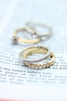 Two diamond wedding bands for a double bride wedding, on a bible verse