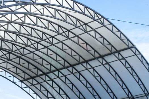 Metal construction with a transparent roof. The latest methods of construction.