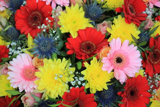 Mixed flower arrangement: various flowers in different colors for a wedding