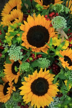 Big yellow sunflowers in a wedding flower arrangement