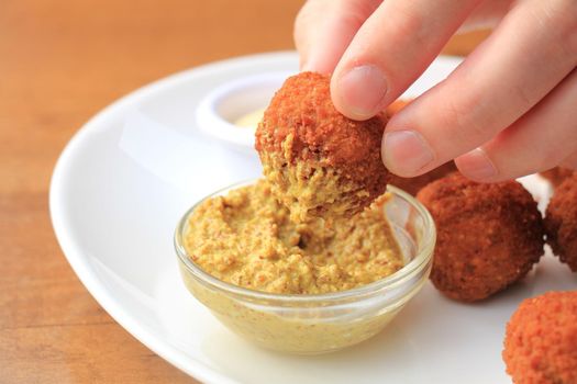 Bitterballen with mustard, warm fried snack, served in the Netherlands