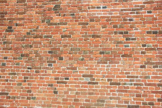 Vintage red bricks in an old brick wall
