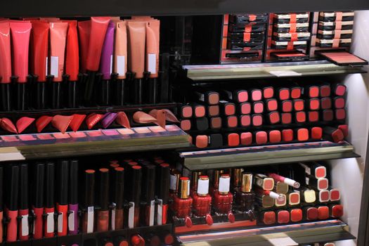 Cosmetics display in a store showing all various colors