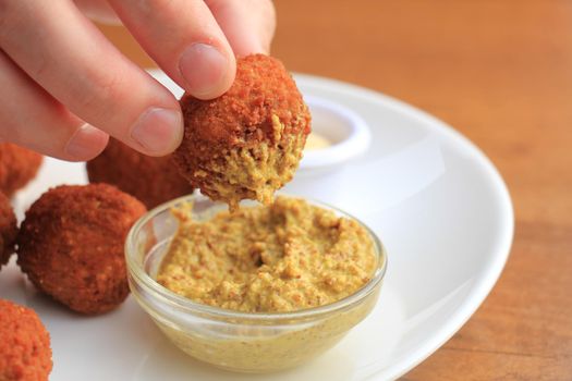 Bitterballen with mustard, warm fried snack, served in the Netherlands