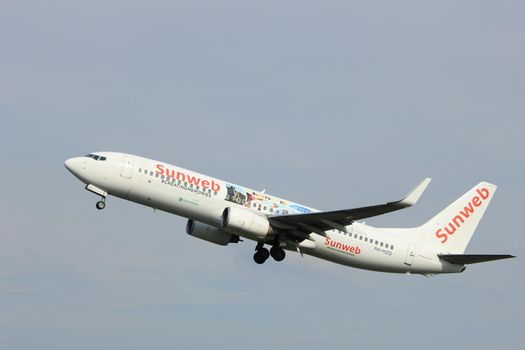 Amsterdam, the Netherlands  -  June 2nd, 2017: PH-HZG Transavia Boeing 737-800 taking off from Polderbaan Runway Amsterdam Airport Schiphol, painted in Sunweb summer 2017 livery