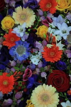 Mixed flower arrangement: various flowers in different colors for a wedding