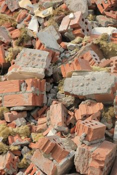 Pile of broken red bricks on construction site