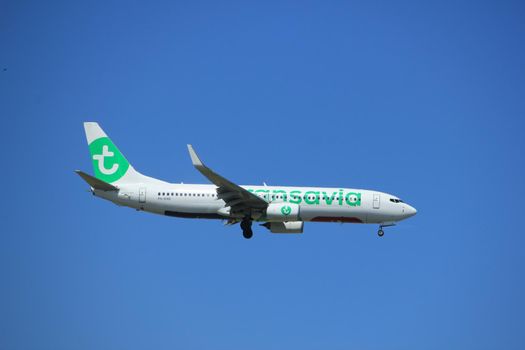 Amsterdam the Netherlands - July 9th 2017: PH-HXB Transavia Boeing 737-800 approaching Schiphol Amsterdam Airport Kaagbaan runway