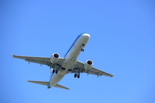 Amsterdam, the Netherlands - April 9th, 2017: PH-EZT KLM Cityhopper Embraer ERJ-190STD approaching Polderbaan runway at Schiphol Amsterdam Airport, the Netherlands