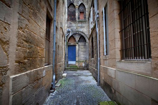 Facade of an old church in a street of Bordeaux, France