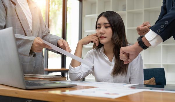 Young businesswoman unhappy with excessive work.