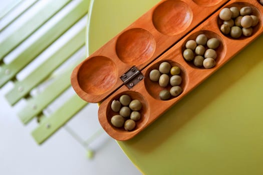 African game awale on a green table