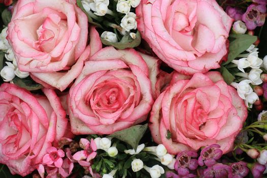 Big pink roses in a floral wedding decoration