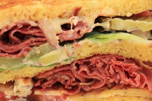 A fresh pastrami sandwich: charcuterie, lettuce, pickles and mayonaisse