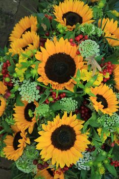 Big yellow sunflowers in a wedding flower arrangement