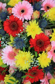 Mixed flower arrangement: various flowers in different colors for a wedding