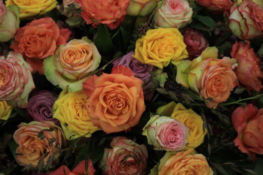 Multicolored roses in a floral wedding decoration