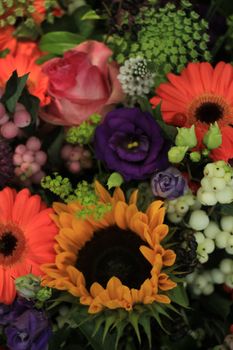 Mixed flower arrangement: various flowers in different colors for a wedding