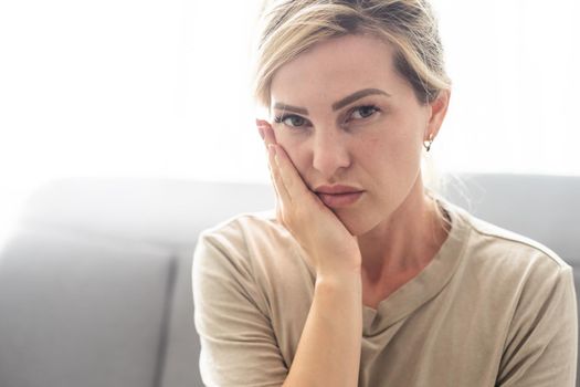 Toothache, Beautiful Woman with Tooth Infection. Young Woman Suffering From Toothache . Close up of pretty disappointed woman which having toothache