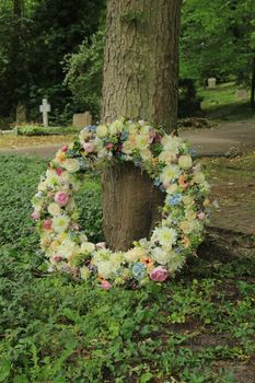 Sympathy wreath in pastel colors, made of various flowers