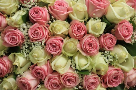 Pink and white  roses in a floral wedding decoration