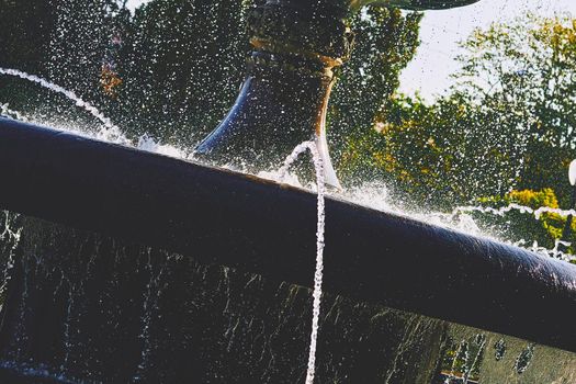 an ornamental structure in a pool or lake from which one or more jets of water are pumped into the air.