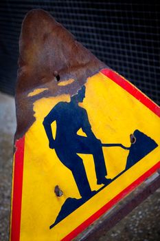 Damaged road sign on a construction site