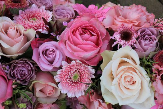 Mixed flowers in different shades of pink in a floral wedding decoration