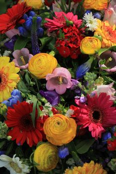 Mixed flower arrangement: various flowers in different colors for a wedding