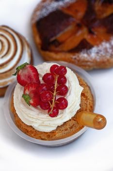 Three pastries on a white workplan