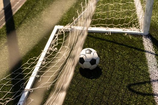 close-up view of leather soccer ball on green grass