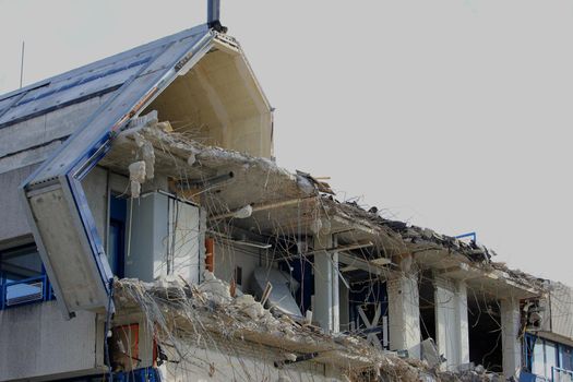 Demolishing a building, half demolished industrial building