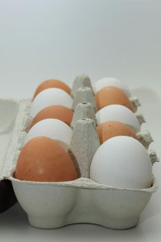 Ten fresh eggs in a carton box