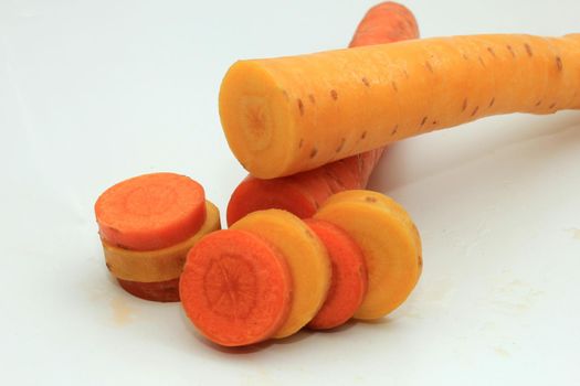 Fresh carrots, orange and yellow, cut in slices