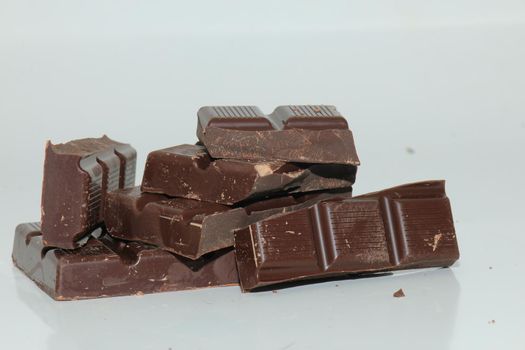 Dark chocolate bar , broken in oneven pieces