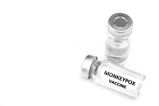 Close up picture of vials filled with Monkeypox vaccine on white background.