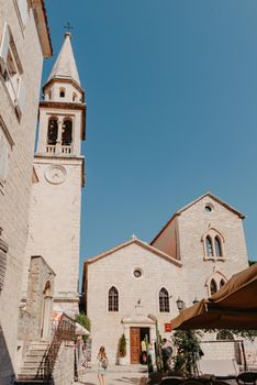 ld Town, Budva, Montenegro. Picturesque square in the well preserved medieval Old town with shops, cafes and restaurants in the Balkans. The view of Budva medieval fortress of St. Mary, Citadel, landscape of Old town Budva, Montenegro: ancient walls, beautiful Landscape