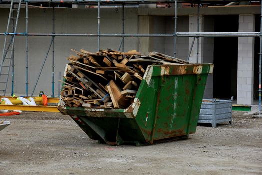 Loaded dumpster near a construction site, home renovation