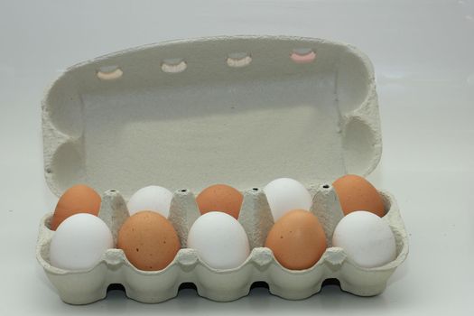 Ten fresh eggs in a carton box