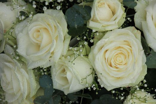 White roses and baby's-breath in a floral wedding decoration