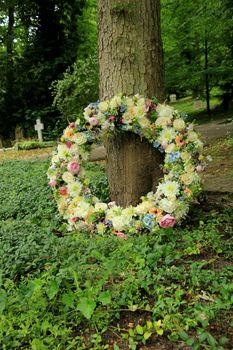 Sympathy wreath in pastel colors, made of various flowers