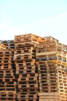 Stacked wooden pallets at a pallet storage