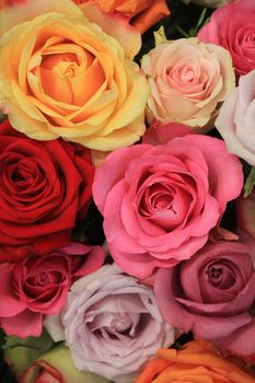 Colorful wedding roses in a floral wedding decoration