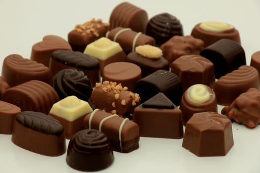 Luxurious chocolates in various shapes and colors